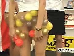 Japan employees play a game with balls and pantyhose